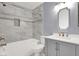 Bathroom features a new bathtub and shower with designer tile, and new vanity and toilet at 584 Sellers Pl, Henderson, NV 89011