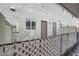 Neutral stucco exterior of the townhome showcasing the front doors and enclosed patio area at 584 Sellers Pl, Henderson, NV 89011