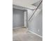 Bright entry hallway featuring tile flooring and staircase to the upper level with access to the garage at 584 Sellers Pl, Henderson, NV 89011