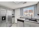 Kitchen features stainless steel appliances and granite countertops with plenty of room for cooking at 584 Sellers Pl, Henderson, NV 89011