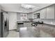 Updated kitchen with stainless steel appliances, granite countertops, and a skylight for added brightness at 584 Sellers Pl, Henderson, NV 89011