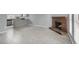 Open-concept living area featuring a brick fireplace, tile flooring, and a seamless connection to the kitchen at 584 Sellers Pl, Henderson, NV 89011