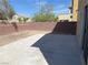 Private backyard with concrete patio and brick wall, perfect for outdoor living at 6182 Blue Rapids Ct, Las Vegas, NV 89139