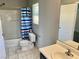 Bathroom with tiled floor, single vanity, and a shower-tub combo at 6182 Blue Rapids Ct, Las Vegas, NV 89139