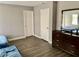Bedroom featuring laminate wood-look flooring, neutral paint and lots of natural light at 6182 Blue Rapids Ct, Las Vegas, NV 89139