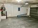 Spacious two car garage featuring painted floors and modern garage door opener at 6182 Blue Rapids Ct, Las Vegas, NV 89139