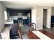 Open kitchen featuring stainless steel appliances, modern cabinetry and an eat in kitchen at 6182 Blue Rapids Ct, Las Vegas, NV 89139
