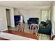 Open-concept living room with modern laminate flooring and access to the staircase at 6182 Blue Rapids Ct, Las Vegas, NV 89139