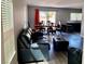 Open-concept living room with modern flooring, dining area, and lots of natural light at 6182 Blue Rapids Ct, Las Vegas, NV 89139