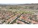 Elevated view of a home with a solar-paneled roof in a well-designed suburban neighborhood near the highway at 648 Sunrise Lake Pl, Henderson, NV 89002