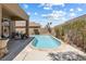Beautiful backyard featuring a pool and covered patio perfect for entertaining and relaxation at 648 Sunrise Lake Pl, Henderson, NV 89002