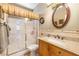 Cozy bathroom featuring a glass shower and wood vanity with granite countertops at 648 Sunrise Lake Pl, Henderson, NV 89002
