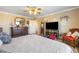 Large bedroom featuring natural lighting, wood floors, and a neutral color palette at 648 Sunrise Lake Pl, Henderson, NV 89002