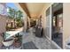 Spacious covered patio area with tile flooring offering shade and outdoor living space at 648 Sunrise Lake Pl, Henderson, NV 89002