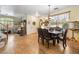 Bright dining room showcasing wood floors and a traditional table set, ideal for Gathering meals and gatherings at 648 Sunrise Lake Pl, Henderson, NV 89002