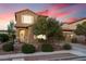 Charming two-story home featuring a well-maintained front yard and a cozy, traditional aesthetic at 648 Sunrise Lake Pl, Henderson, NV 89002
