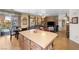 Open-concept kitchen featuring granite counters, stainless appliances, and an island with seating at 648 Sunrise Lake Pl, Henderson, NV 89002