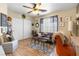Cozy living room featuring a ceiling fan, neutral paint, and wood floors at 648 Sunrise Lake Pl, Henderson, NV 89002