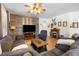 The main living area is anchored by a fireplace with comfortable seating and stylish decor at 648 Sunrise Lake Pl, Henderson, NV 89002