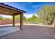 Spacious backyard with a covered patio and desert landscaping, perfect for outdoor enjoyment at 6480 Chebec St, North Las Vegas, NV 89084