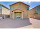 Cozy covered patio and low-maintenance backyard with desert landscaping, perfect for relaxation and entertaining at 6480 Chebec St, North Las Vegas, NV 89084