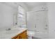 Clean bathroom with a tub and shower combo, vanity with sink, and a toilet with a window for natural light at 6480 Chebec St, North Las Vegas, NV 89084