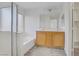 Bathroom featuring a double vanity, soaking tub, and separate shower at 6480 Chebec St, North Las Vegas, NV 89084