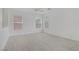 Bright bedroom with wood-look tile floors and multiple windows at 6480 Chebec St, North Las Vegas, NV 89084