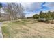 Greenbelt view with mature trees and path, offering a scenic outdoor living space at 6480 Chebec St, North Las Vegas, NV 89084
