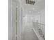 Hallway featuring neutral walls and carpeting, with access to stairs and views of the living area at 6480 Chebec St, North Las Vegas, NV 89084