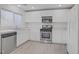 Bright kitchen showcases stainless steel dishwasher and marble counters at 6480 Chebec St, North Las Vegas, NV 89084