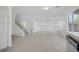 Open floor plan featuring staircase and sliding glass doors at 6480 Chebec St, North Las Vegas, NV 89084