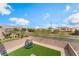 The backyard has a small trampoline and gravel surrounding a small block wall at 7132 Sayonara Vista St, North Las Vegas, NV 89084