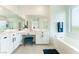 Primary bathroom featuring dual sinks, vanity and large tub at 7132 Sayonara Vista St, North Las Vegas, NV 89084