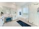 Bathroom featuring dual sinks, vanity, large tub and glass-enclosed shower at 7132 Sayonara Vista St, North Las Vegas, NV 89084