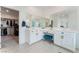 Bathroom with dual sinks, vanity, and access to walk-in closet at 7132 Sayonara Vista St, North Las Vegas, NV 89084