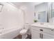 Bright bathroom with a white tub, white subway tile, and modern vanity at 7132 Sayonara Vista St, North Las Vegas, NV 89084