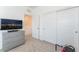 Bedroom featuring closet and dresser with television at 7132 Sayonara Vista St, North Las Vegas, NV 89084