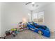 Fun themed bedroom with unique car bed, ceiling fan, and natural light at 7132 Sayonara Vista St, North Las Vegas, NV 89084