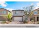 Charming home with stone accents, paved driveway, and neat landscaping at 7132 Sayonara Vista St, North Las Vegas, NV 89084