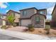 Charming two-story home with a stone-accented facade and brick driveway at 7132 Sayonara Vista St, North Las Vegas, NV 89084