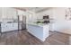 Kitchen with stainless steel appliances, white cabinets, granite counters and center island at 7132 Sayonara Vista St, North Las Vegas, NV 89084