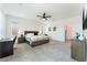 Spacious main bedroom with neutral carpet, ceiling fan and lots of light at 7132 Sayonara Vista St, North Las Vegas, NV 89084