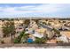Residential area aerial view: cozy homes, lush greenery, and a tidy street layout at 730 Rusty Spur Dr, Henderson, NV 89014