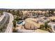 Aerial view of a charming residential neighborhood with well-manicured lawns and a tranquil waterway nearby at 730 Rusty Spur Dr, Henderson, NV 89014