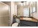 Bathroom featuring granite countertops, and a glass enclosed shower, plus an organized vanity at 730 Rusty Spur Dr, Henderson, NV 89014