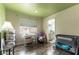 Cozy room with green ceiling, a window, and a glimpse into an en-suite bathroom at 730 Rusty Spur Dr, Henderson, NV 89014