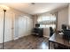 Bedroom featuring wood floors, natural light, and two separate workspaces at 730 Rusty Spur Dr, Henderson, NV 89014