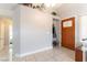 Inviting foyer features tile flooring, coat closet, and stylish front door with glass detail at 730 Rusty Spur Dr, Henderson, NV 89014