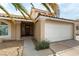 Charming front entrance with a 2-car garage and beautiful desert landscaping at 730 Rusty Spur Dr, Henderson, NV 89014